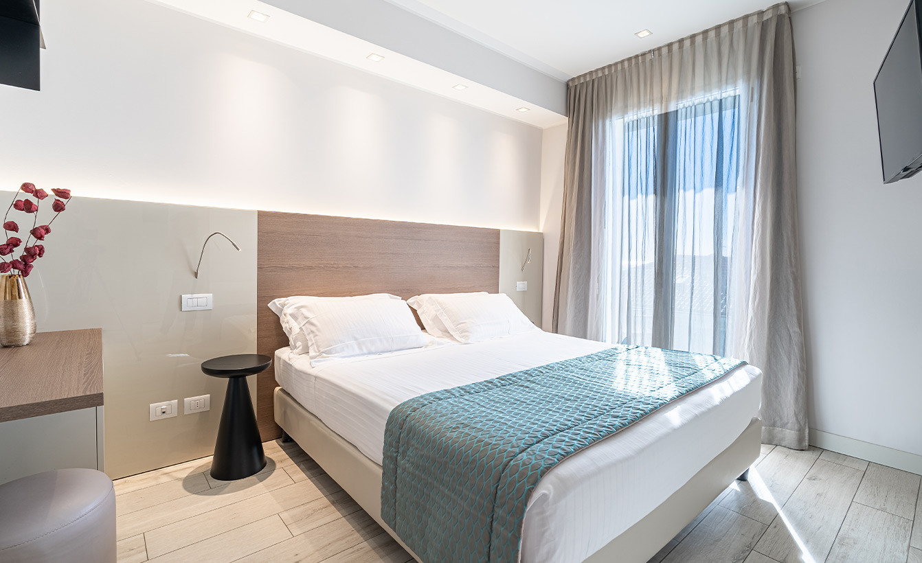 media.camere-delexu-family-2-1-hotel-savini-igea-marina