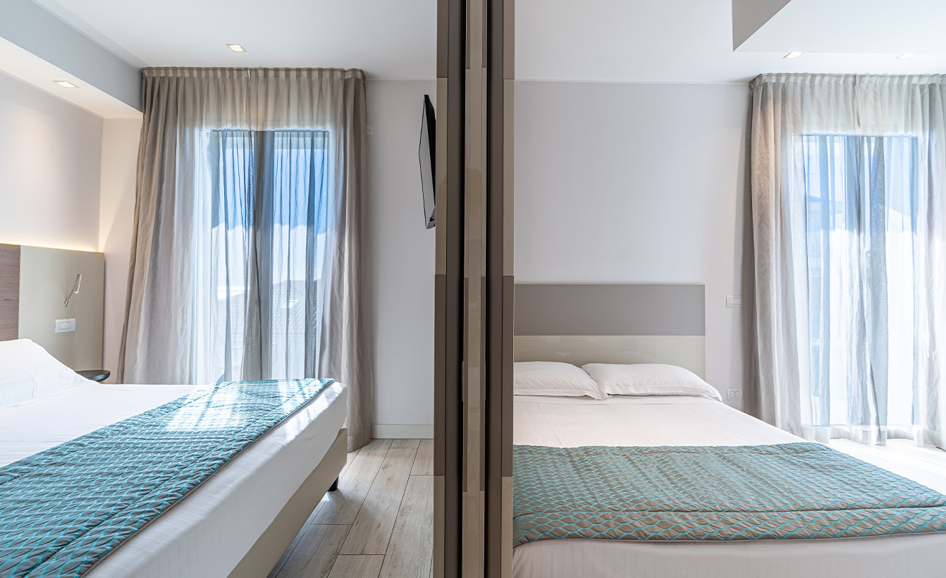 media.camere-delexu-family-3-1-hotel-savini-igea-marina